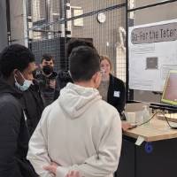 two people looking at a senior project